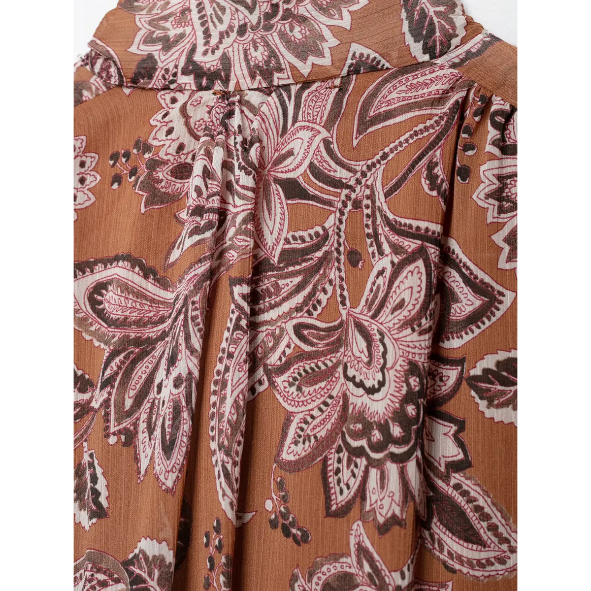 Close-up of back pleat detail and paisley print