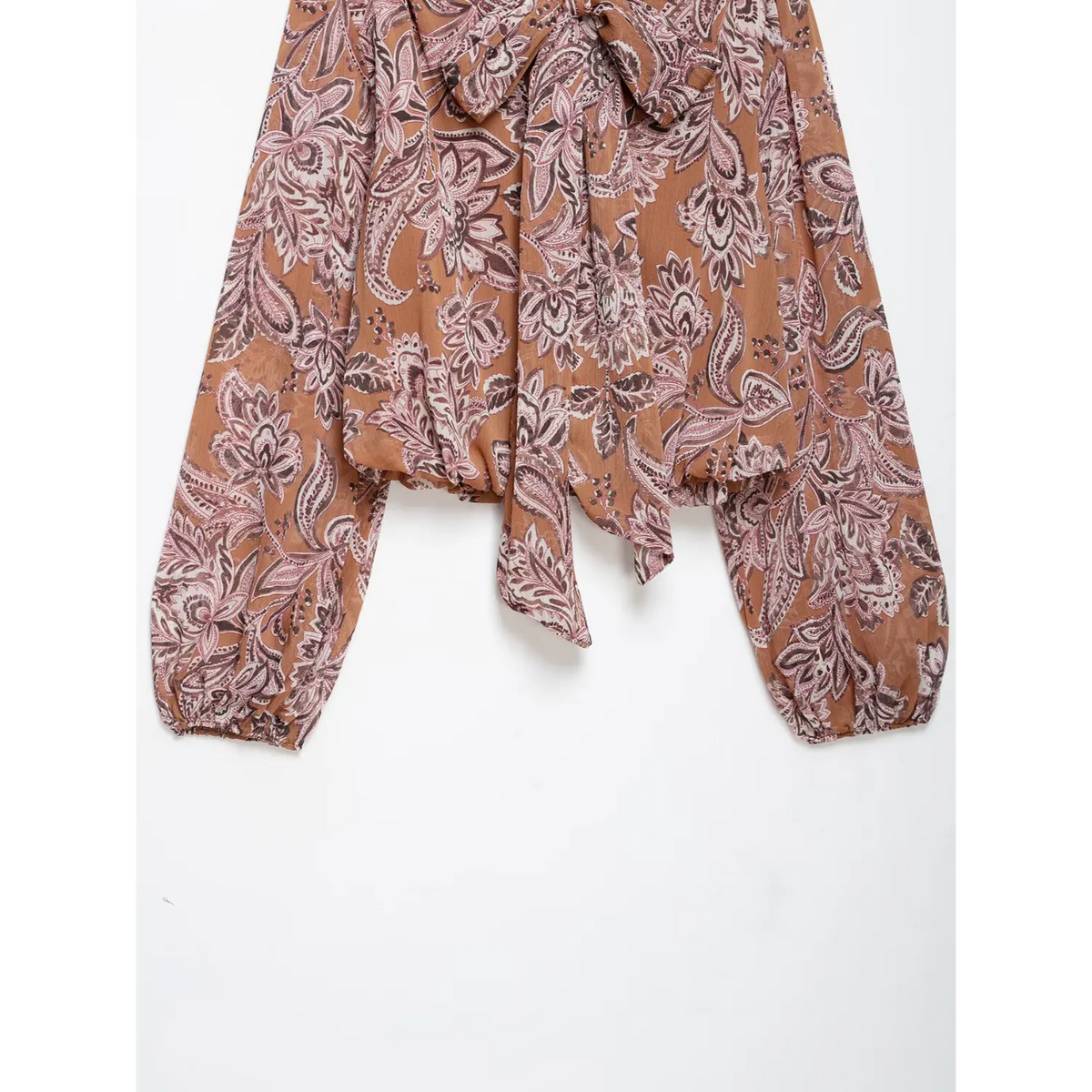Close-up of hem and tie bow detail