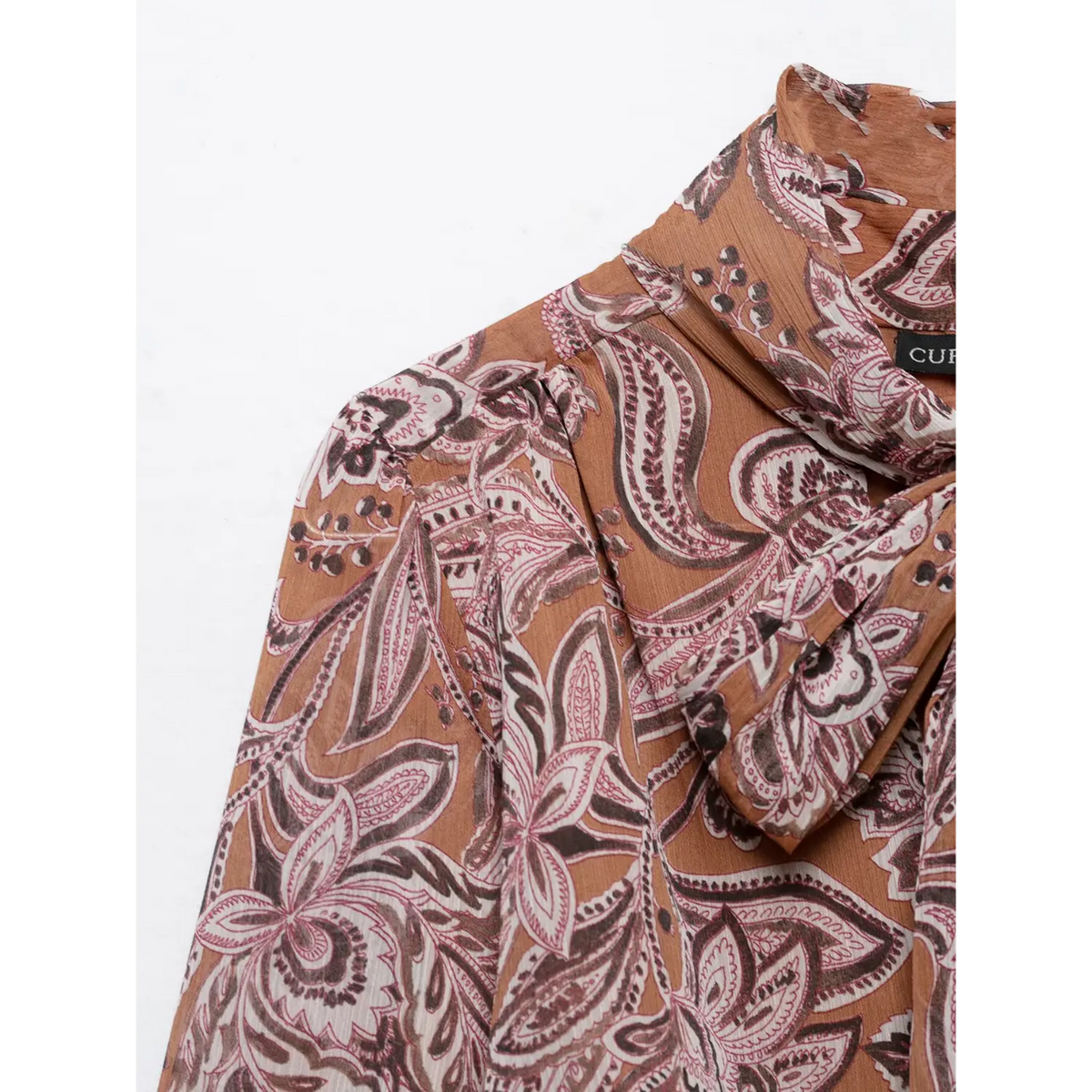 Close-up of shoulder seam and tie neckline