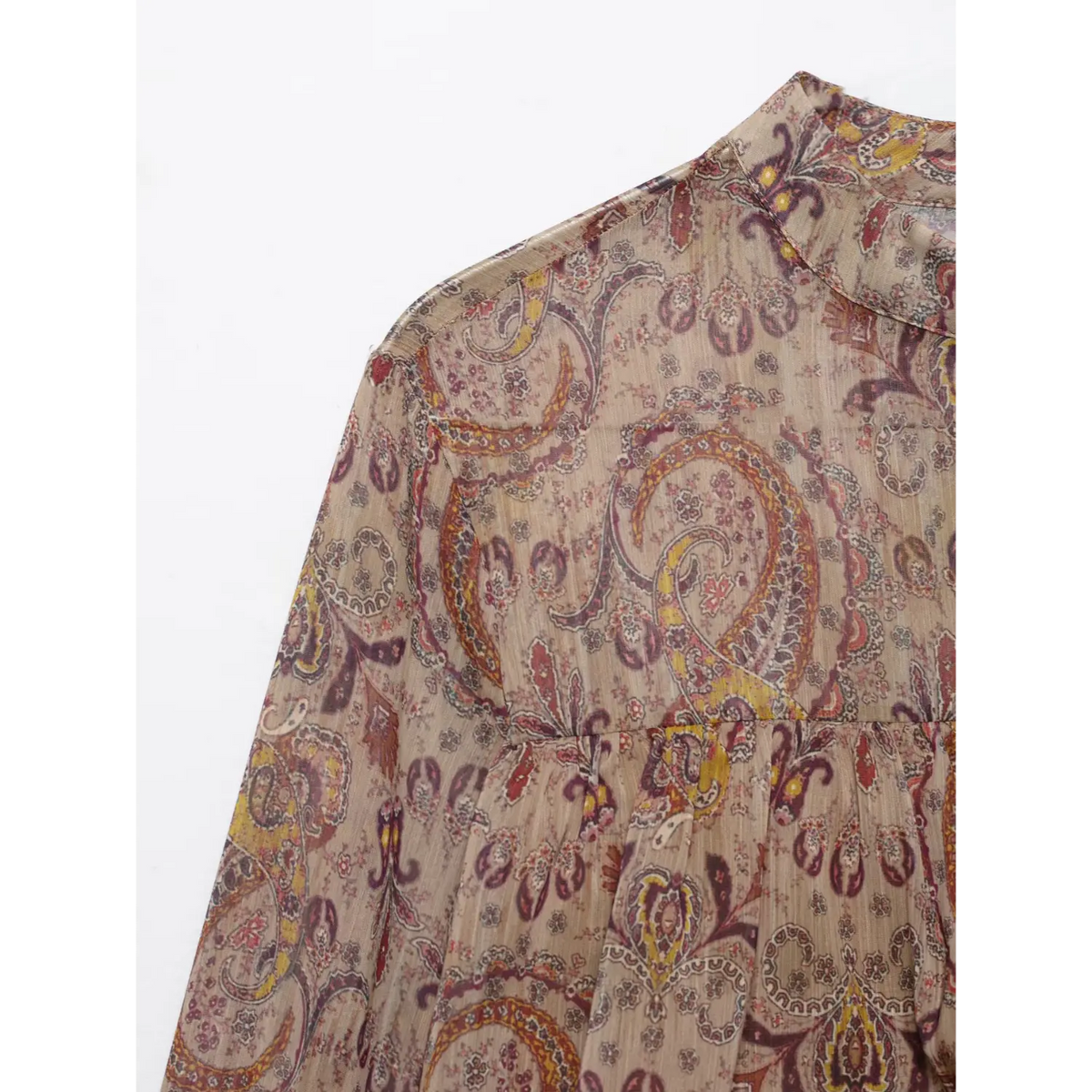 Close-up of shoulder and paisley print