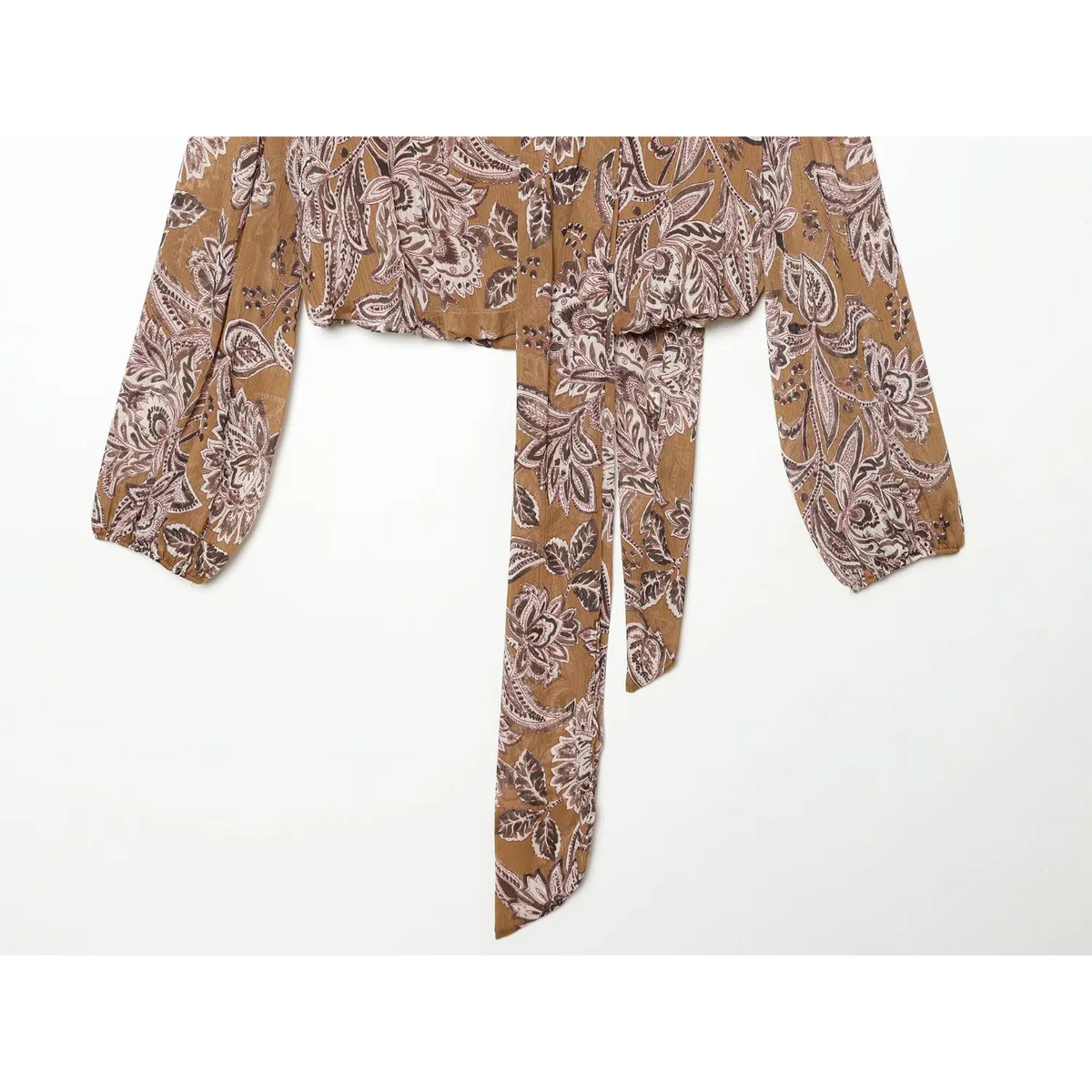 Close-up of cropped hem and hanging tie sash