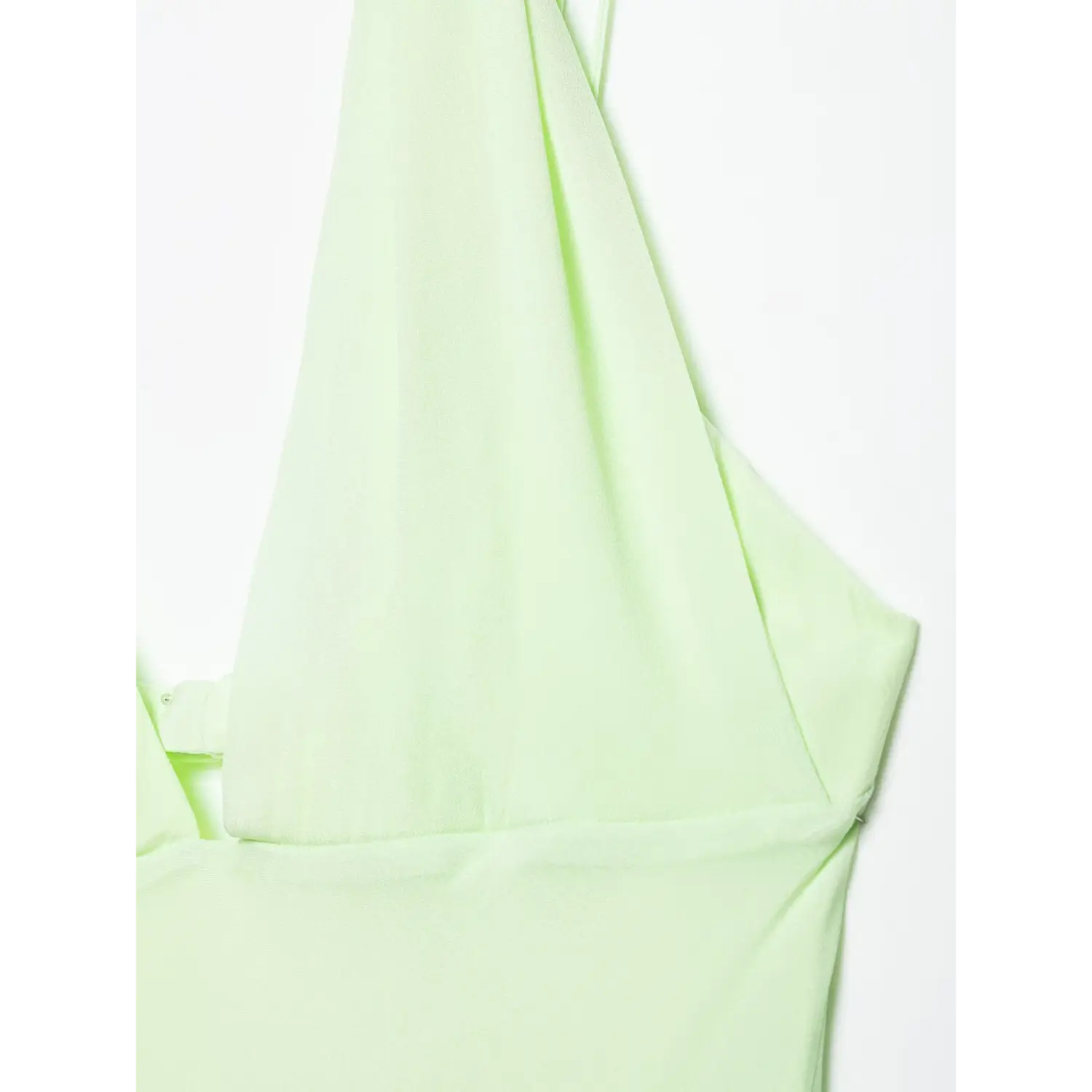 Lifestyle photo of woman in pale mint green maxi dress, outdoor casual elegant look