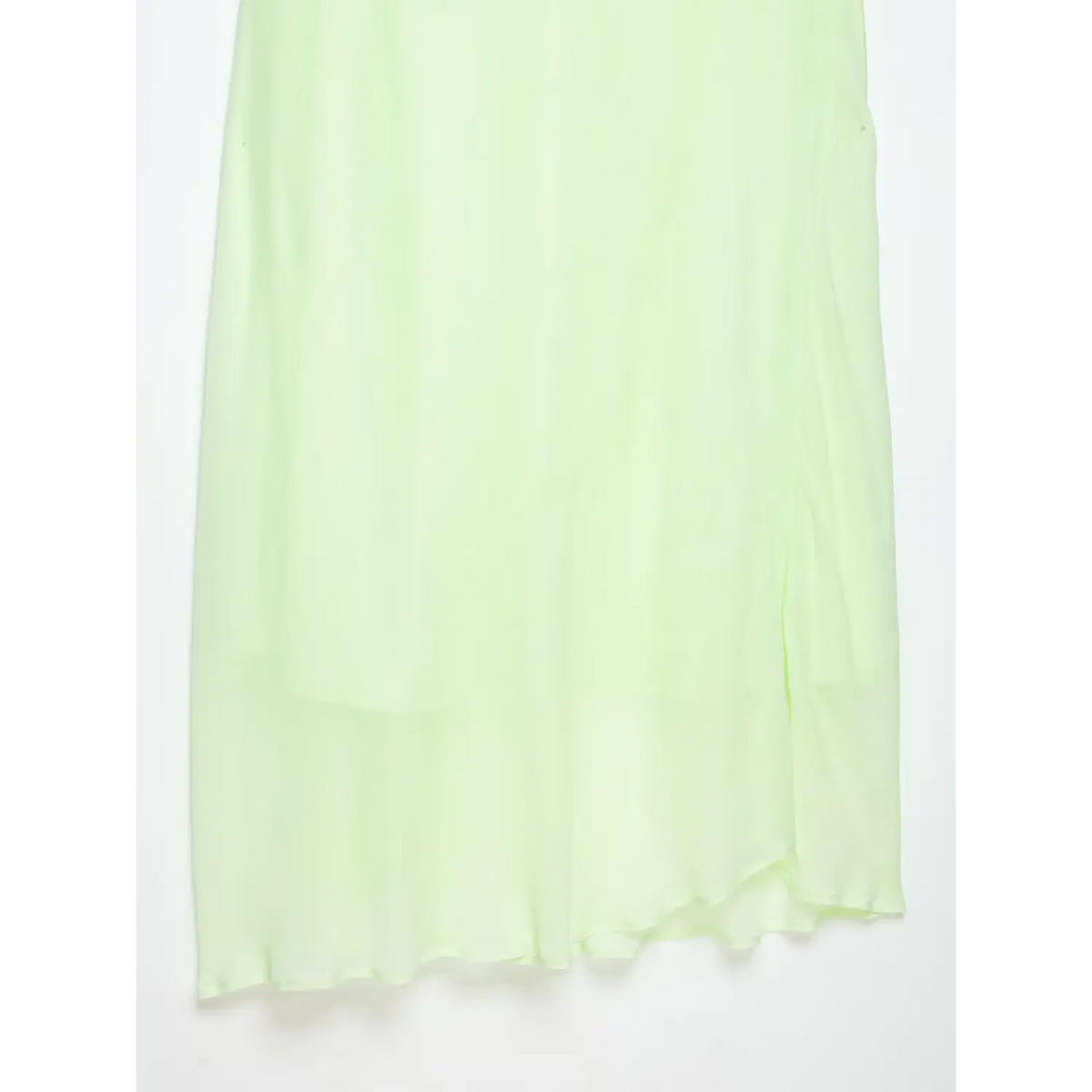 Pale mint green maxi dress skirt hem close-up, flowy lightweight chiffon, soft ruffled hem, side slit detail