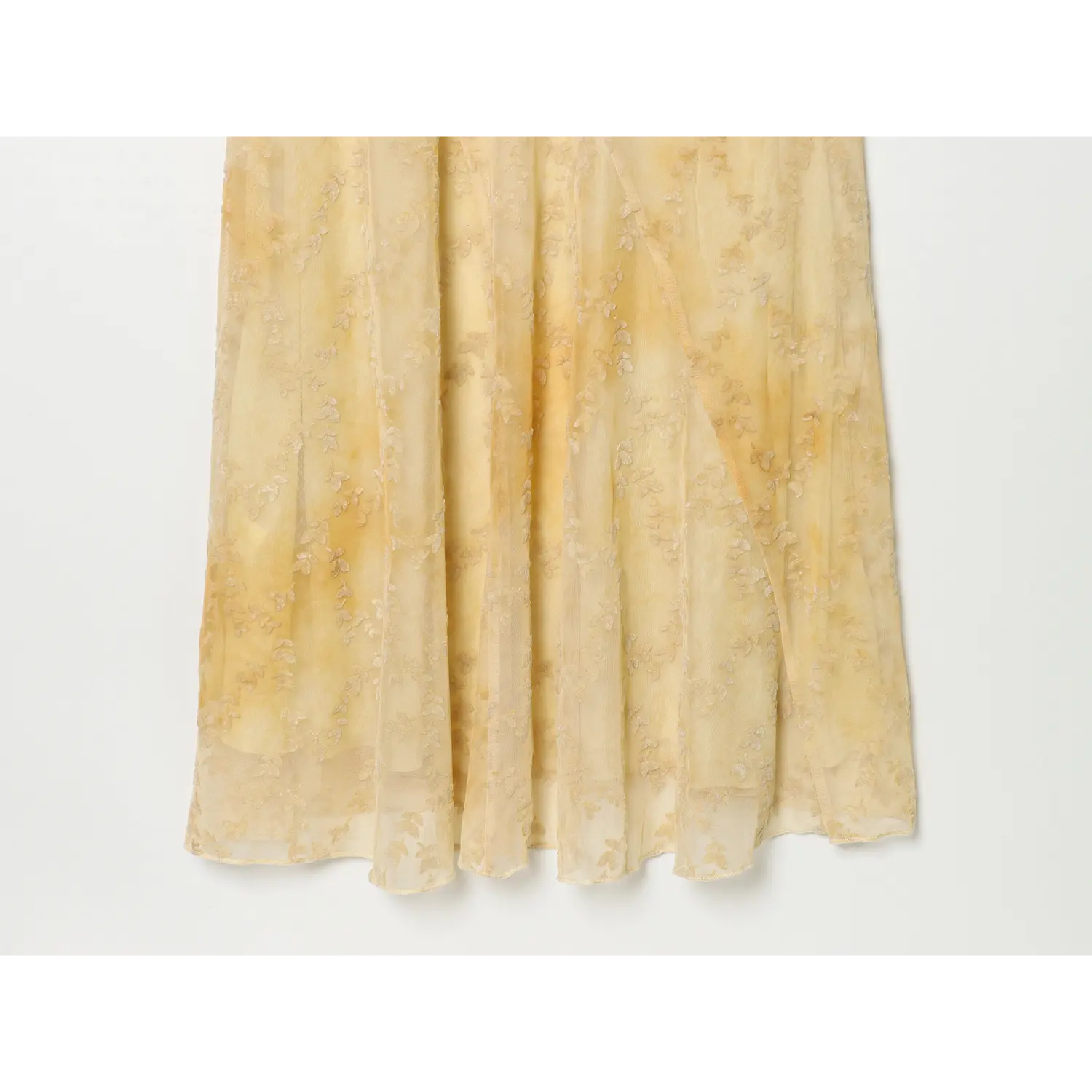 Full skirt hem view of pale yellow leaf jacquard mesh maxi dress, flowy bias cut long hem, layered mesh design