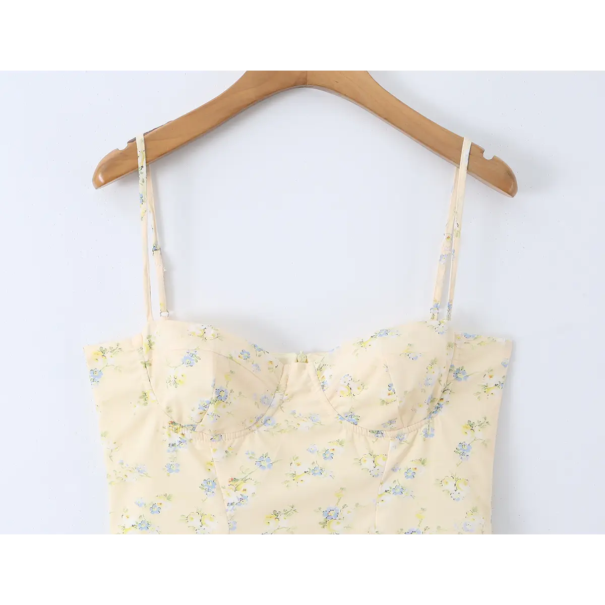  Full front view of the pale yellow floral dress, showing the sweetheart neckline, adjustable straps, and fitted bodice.