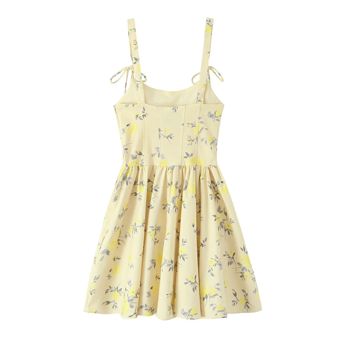 Full back view of a pale yellow floral print spaghetti strap mini dress, showing the structured back and tie straps.