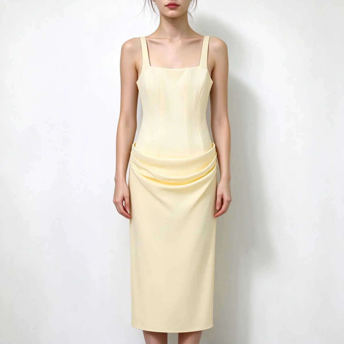Model front view, pale yellow square neck spaghetti strap maxi dress, structured corset bodice, draped folded waist detail, elegant maxi dress