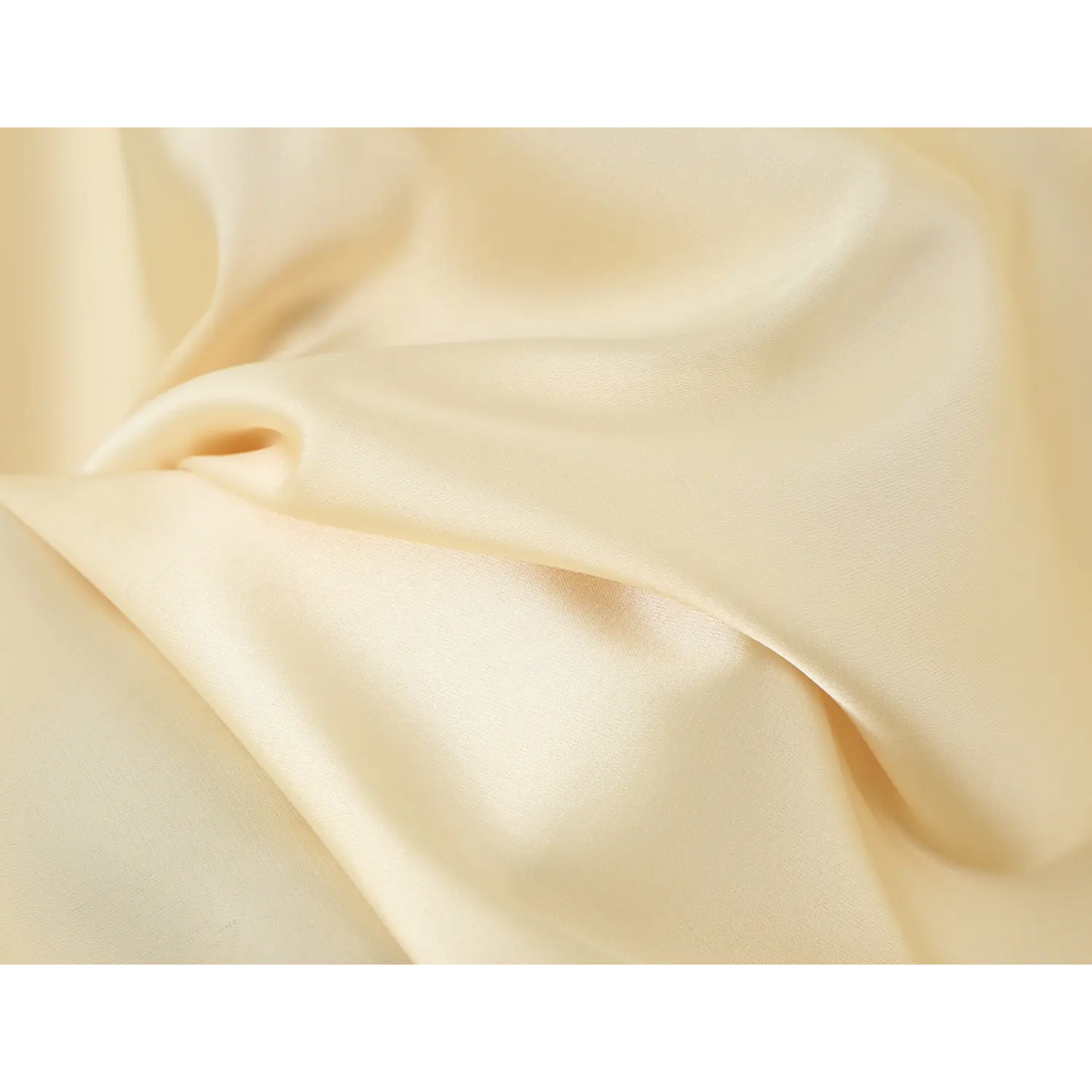 Close‑up of soft glossy pale yellow satin fabric texture