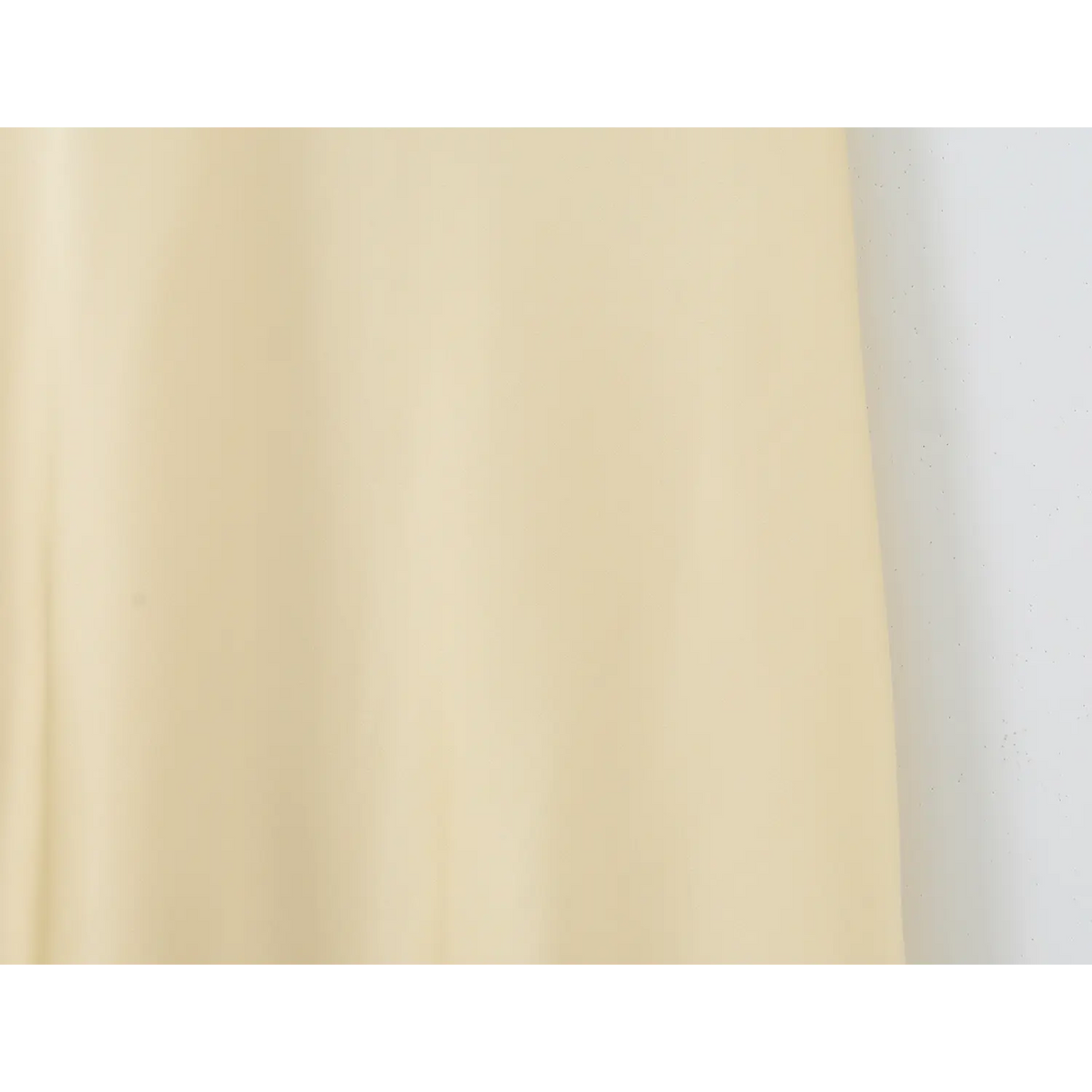 Smooth pale yellow satin upper skirt flat view