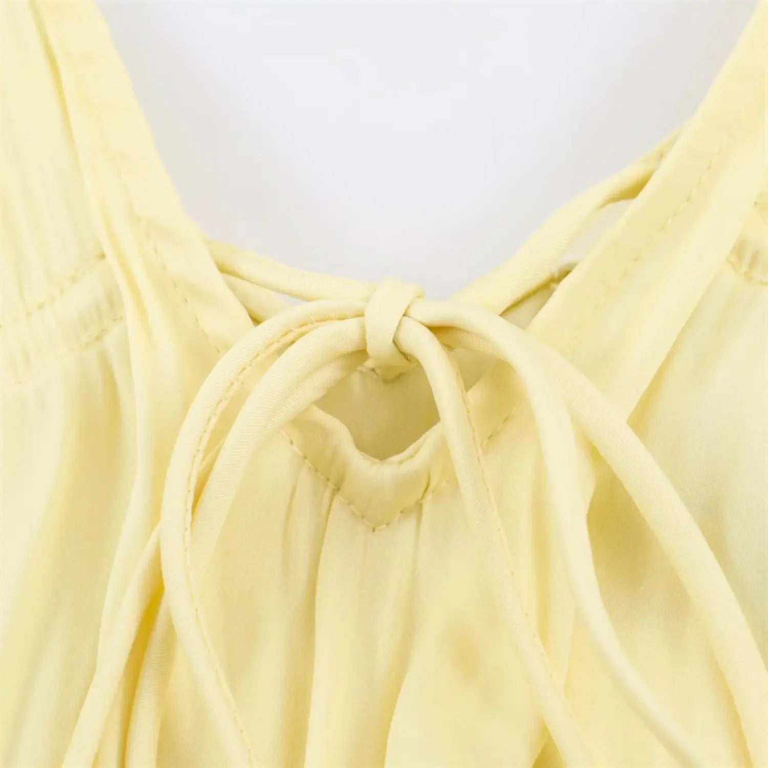 Macro close‑up of back neck tie knot detail