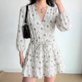 Model front view wearing palm tree print mini dress, show overall fit and silhouette