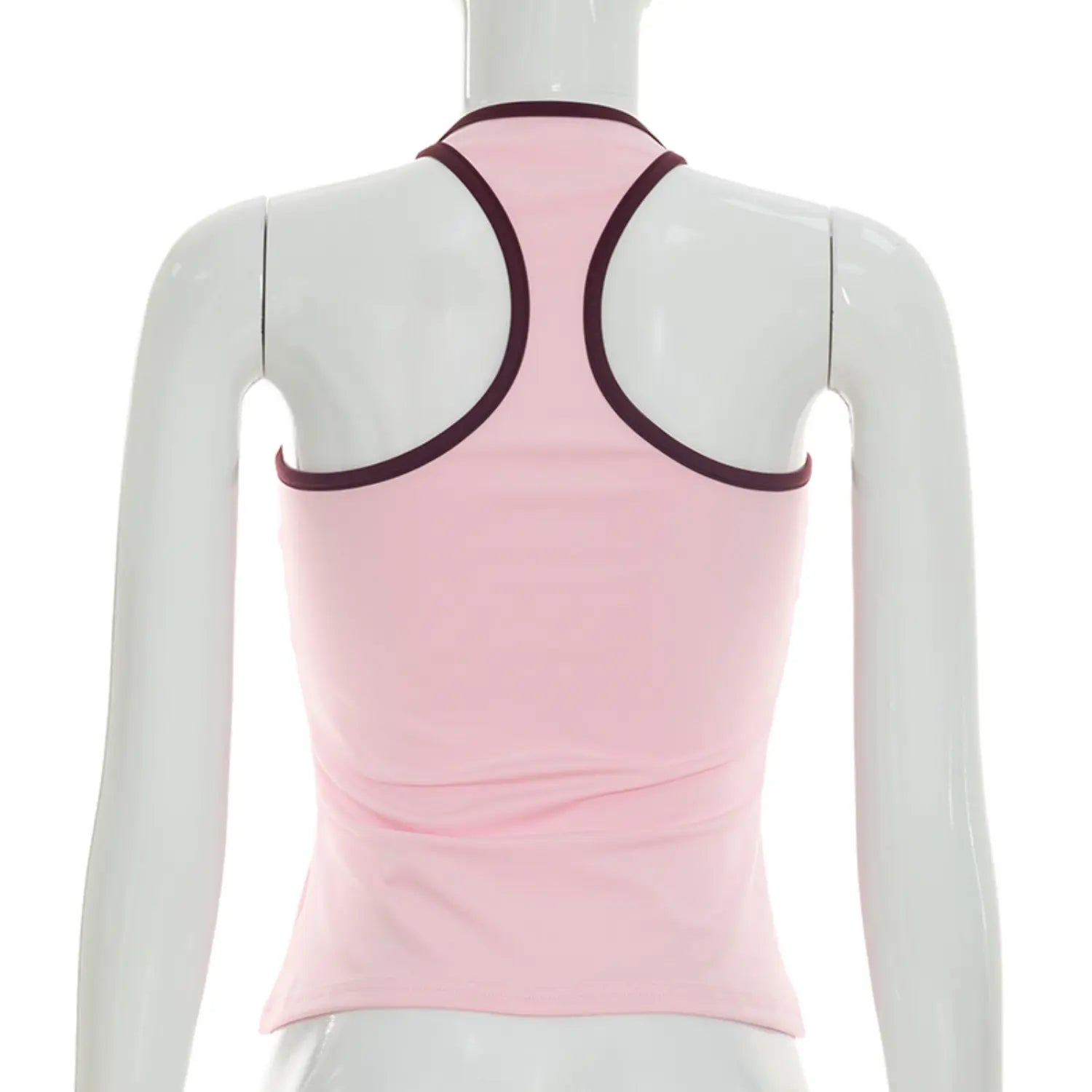 Full back white studio mannequin shot of fitted halter tank top, solid baby pink body with wine burgundy contrast binding on halter straps and neckline, open racerback cutout, subtle waist ruching slim cropped silhouette
