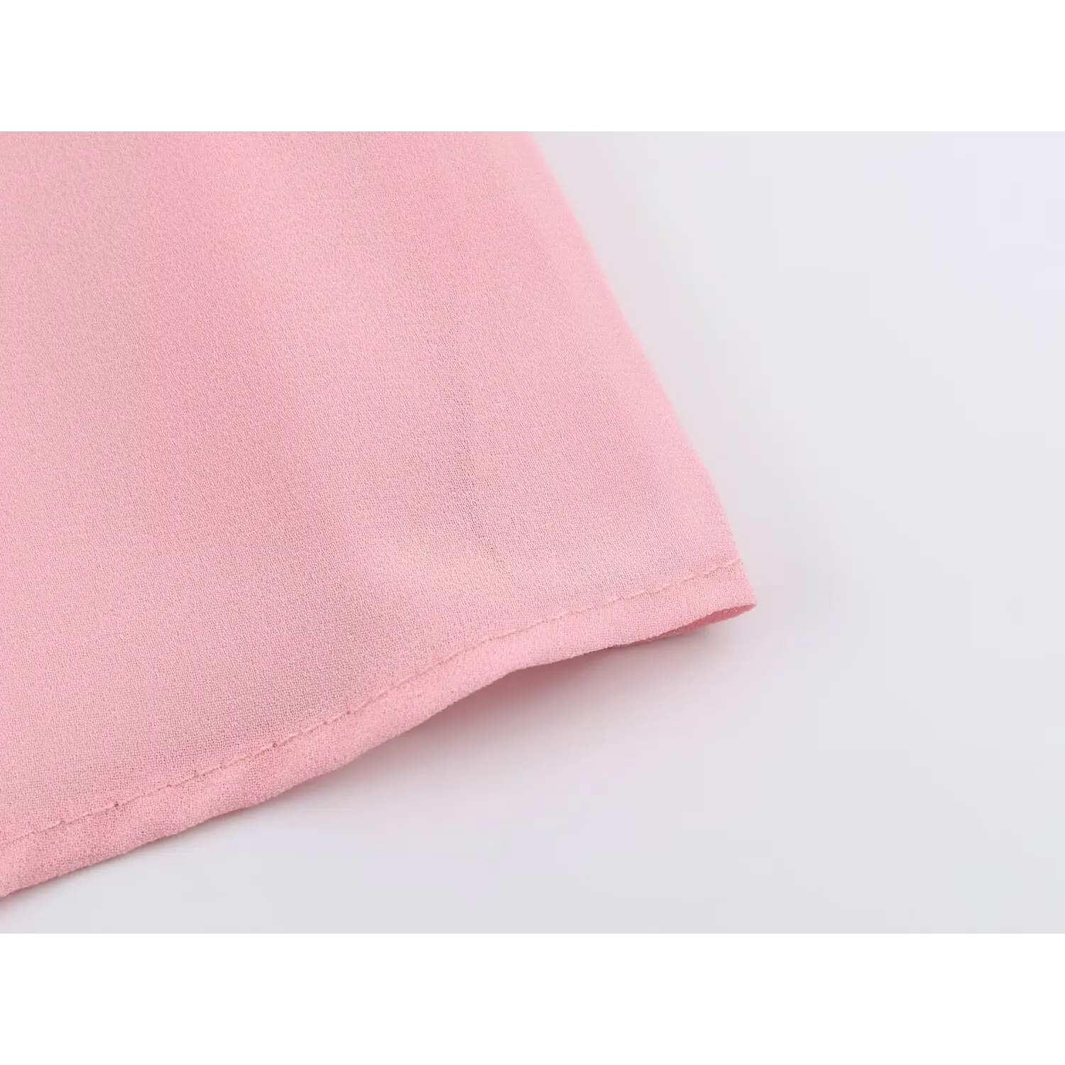 Macro shot chiffon hem material texture, neat finished bottom seam