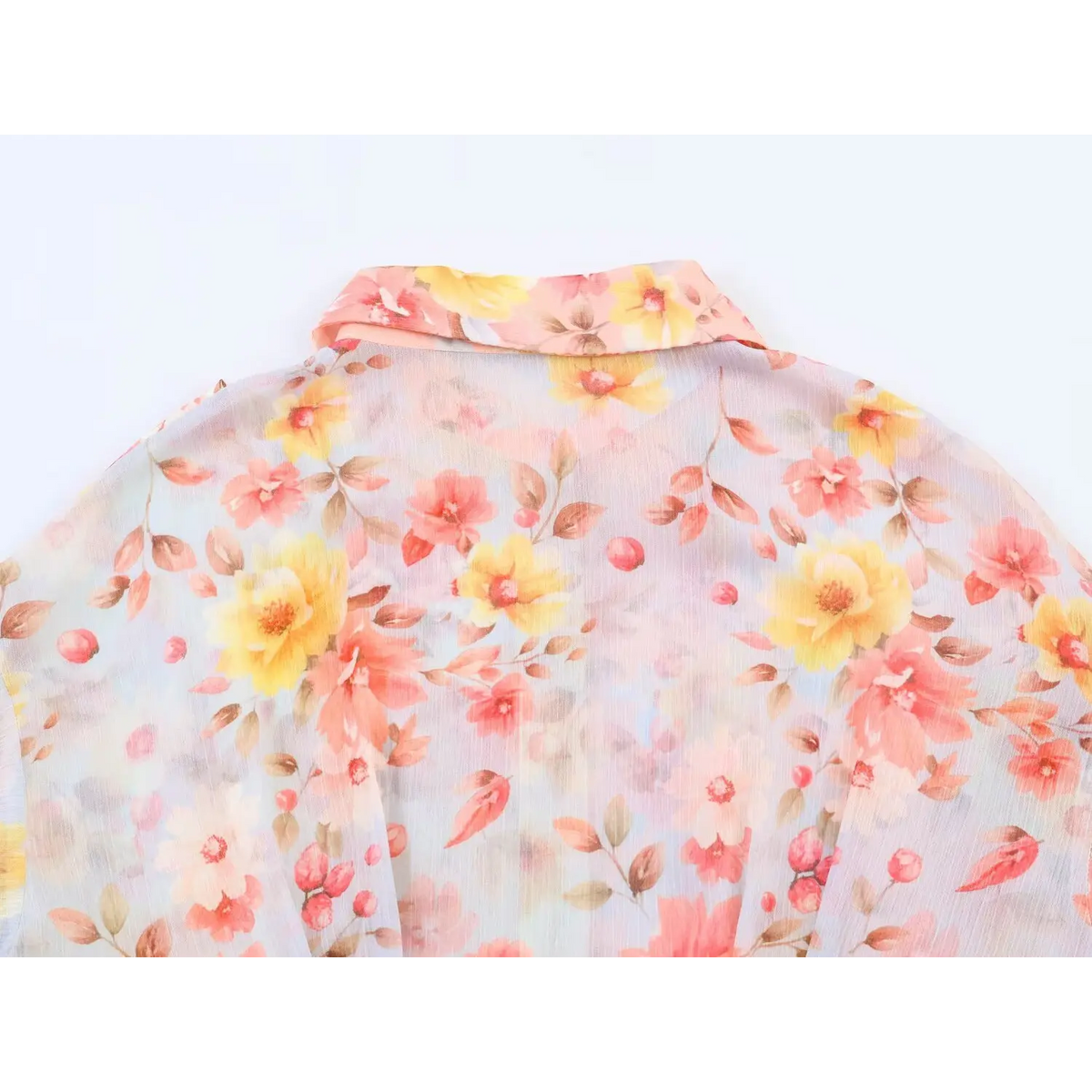Close‑up of back yoke with mixed watercolor floral print on chiffon maxi dress