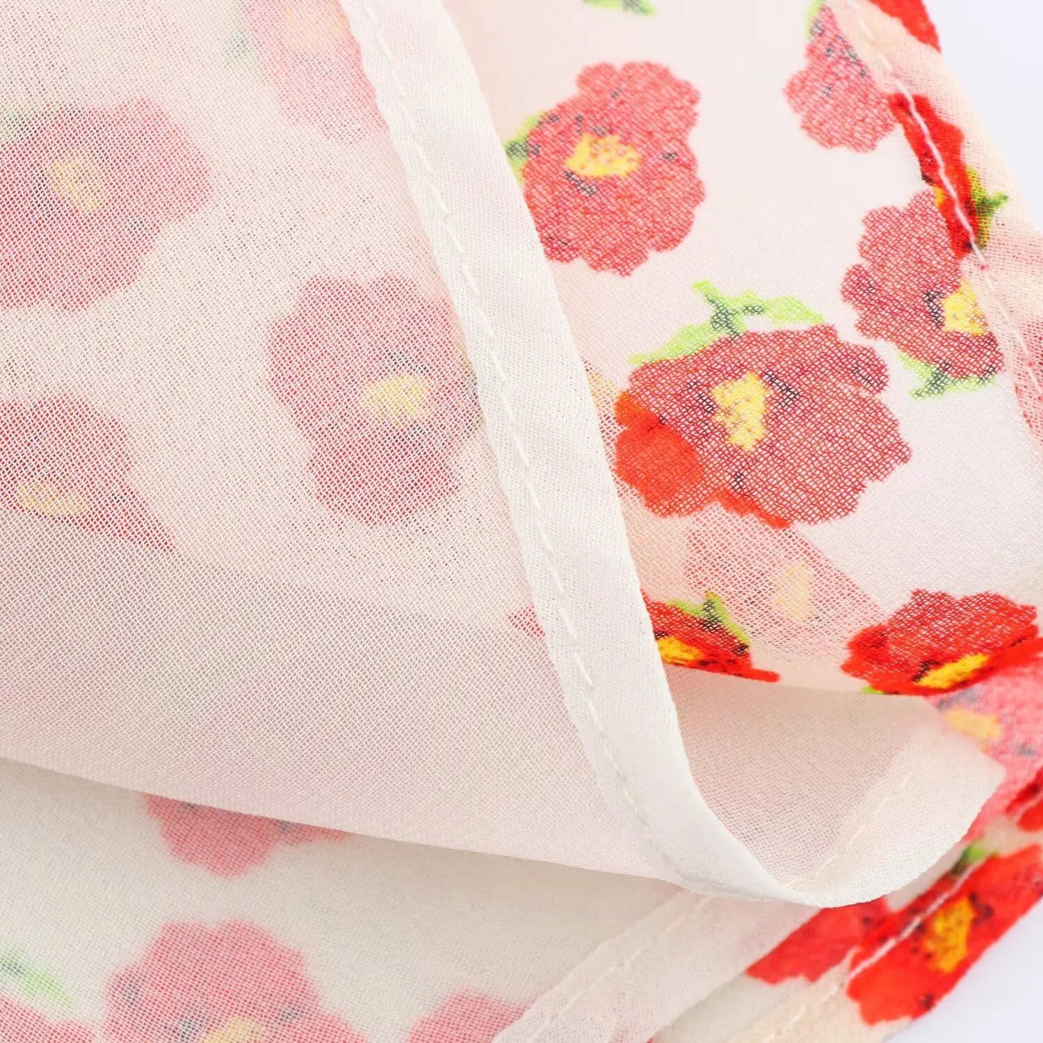 Close-up of the inner lining and finished hem on the peach floral chiffon dress