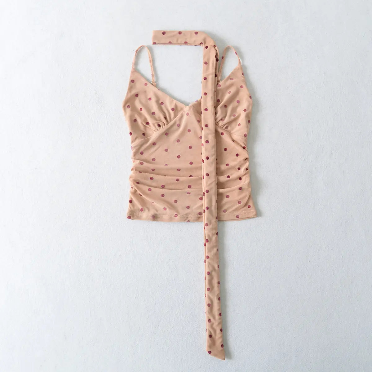 Full front view of the peach pink mesh cami top with burgundy polka dots, including the matching long scarf tie.