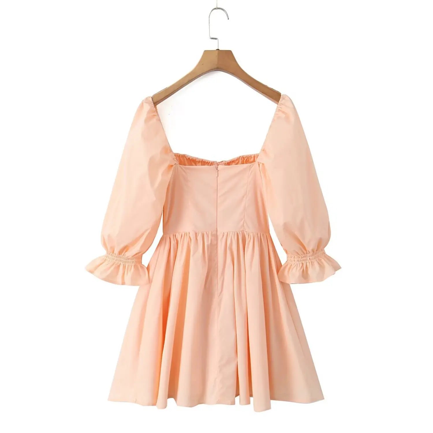 Back view peach square neck mini dress hanging on hanger, back zipper detail and balloon elbow sleeves