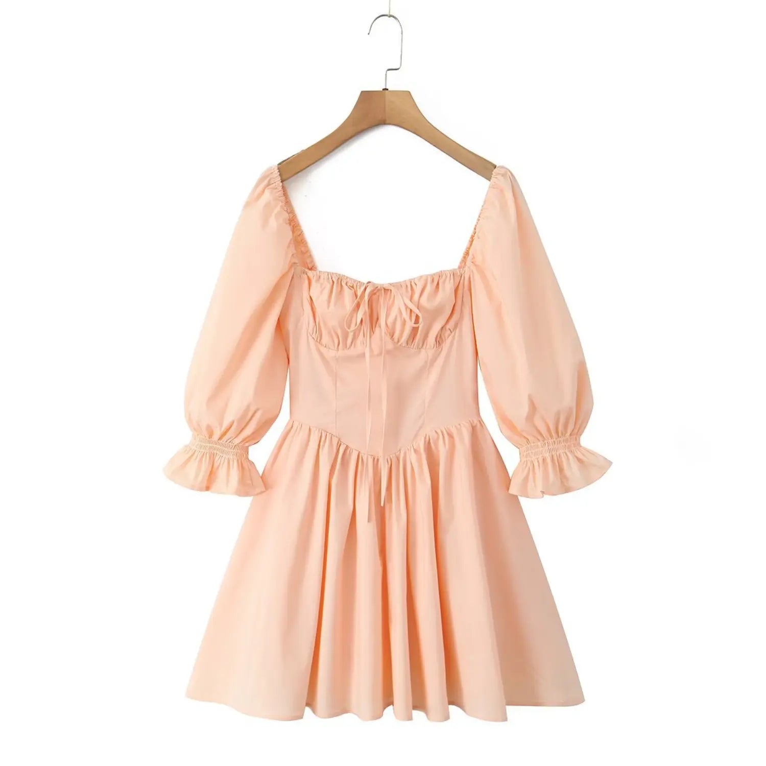 Peach puff sleeve mini dress on wooden hanger, square neck tie‑front bustier dress with ruffle cuff sleeves