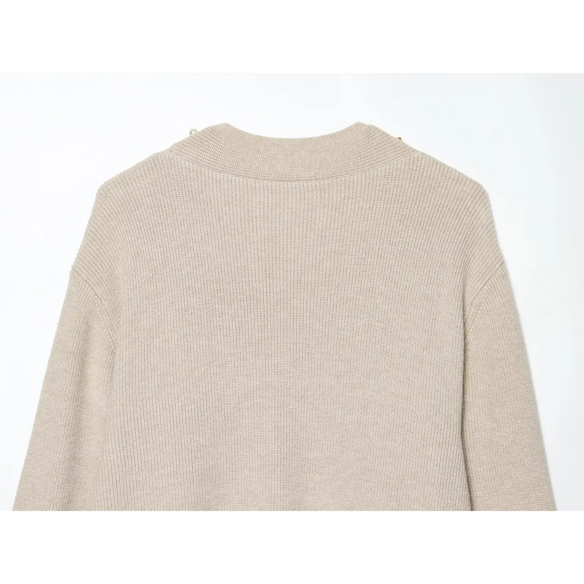 Close-up of back neckline ribbed band and shoulder seam