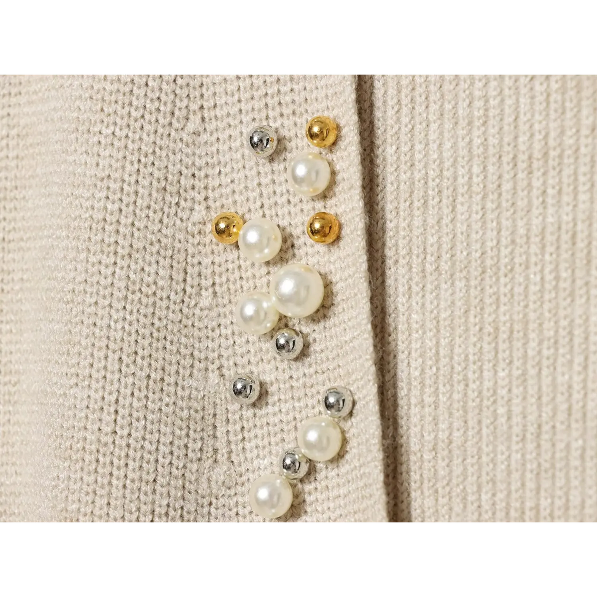 Close-up of mixed pearl, gold and silver bead embellishment detail