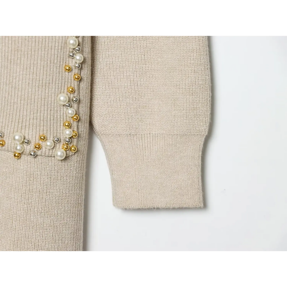 Close-up of ribbed cuff and beaded pocket corner