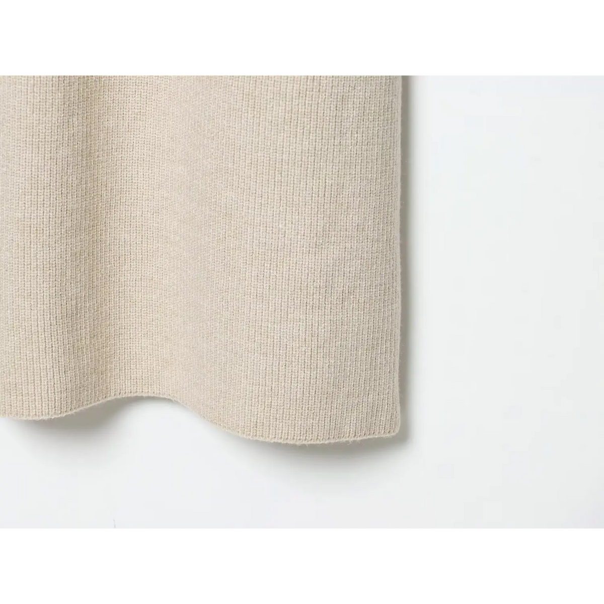 Close-up of ribbed hem edge and knit texture
