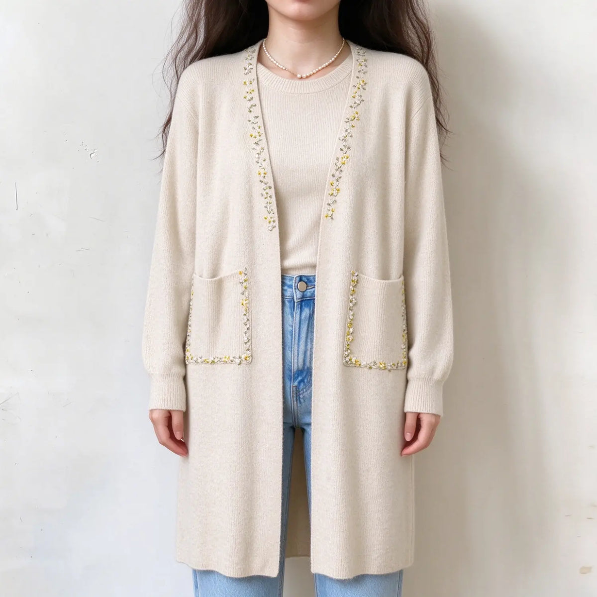 Model wearing oatmeal pearl beaded longline knit cardigan, front view