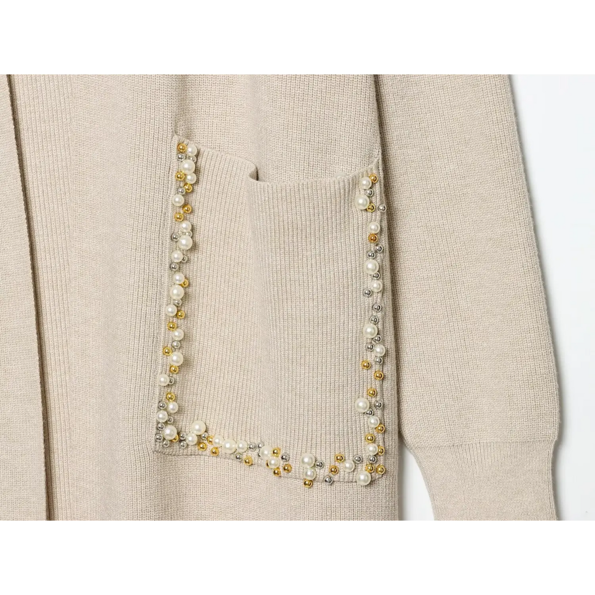 Close-up of patch pocket edged with pearl, gold and silver beads