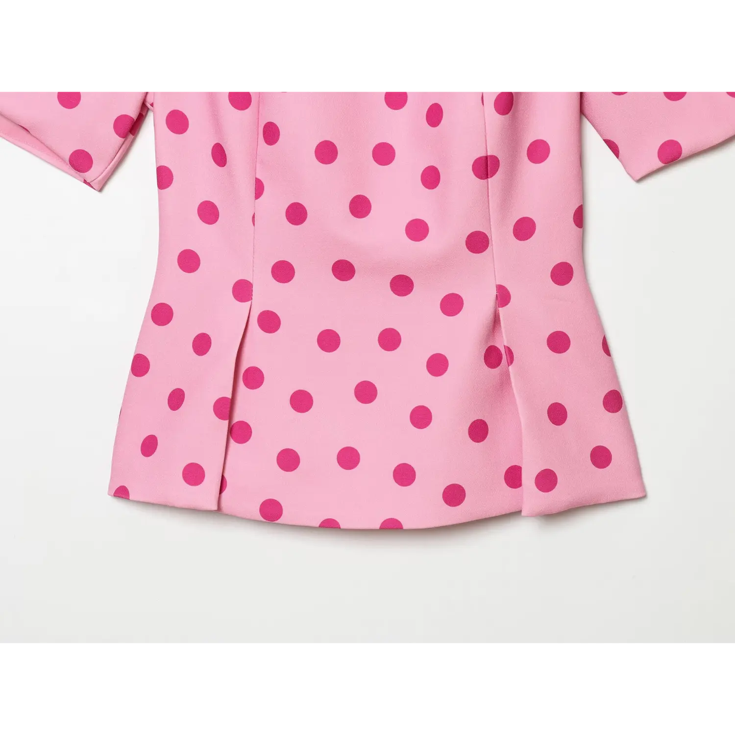 Full bottom view flared peplum hem with vertical side splits and tailored seams