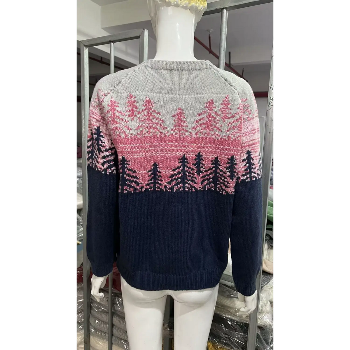 Back view of pine forest fair isle knit sweater on mannequin