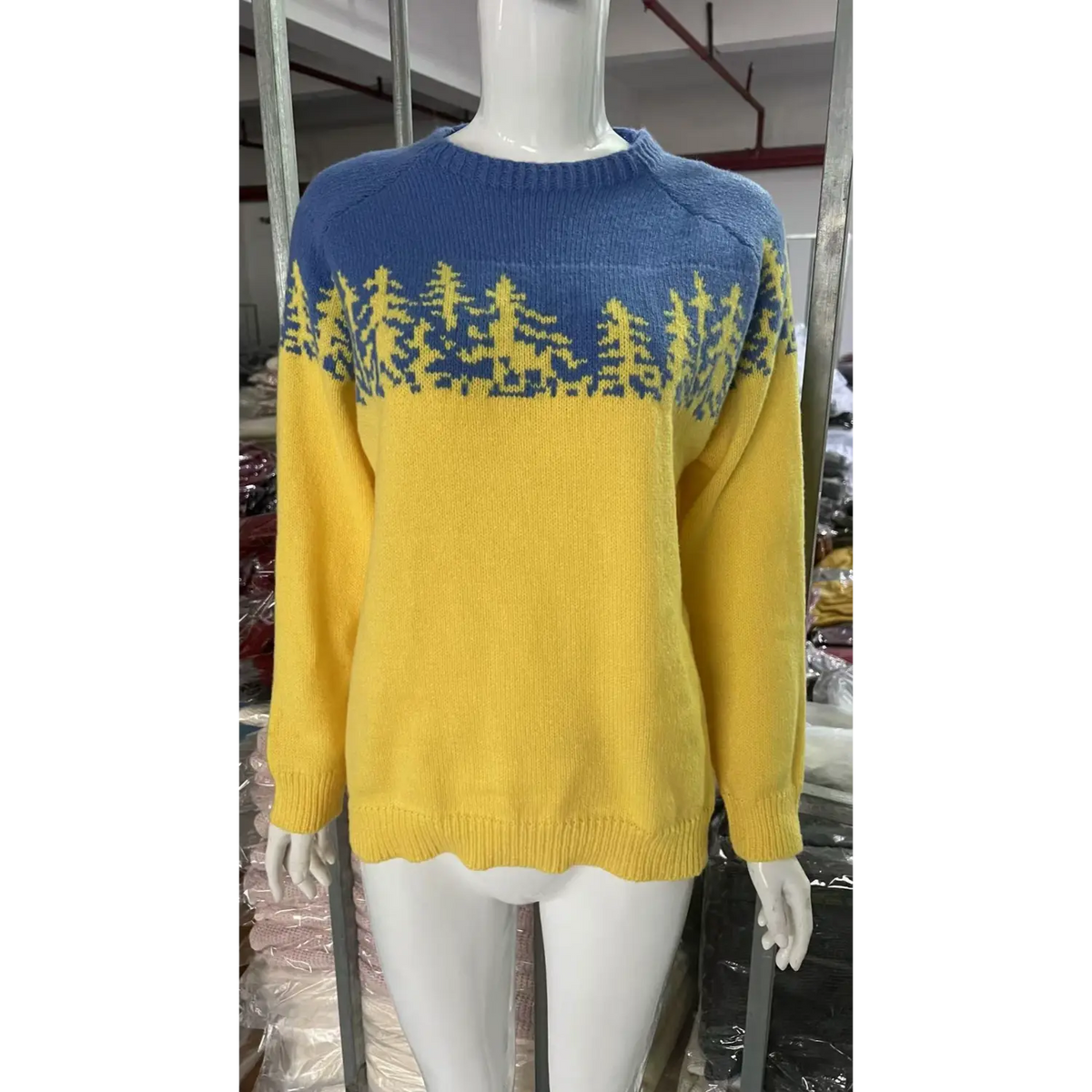 Front view of pine tree colorblock yoke knit sweater on mannequin