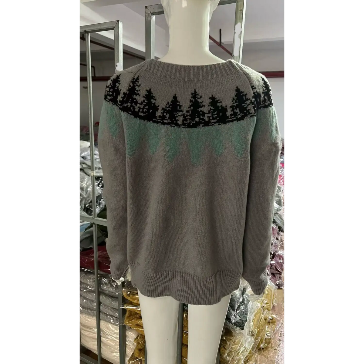 Back view of pine tree fair isle yoke knit sweater on mannequin