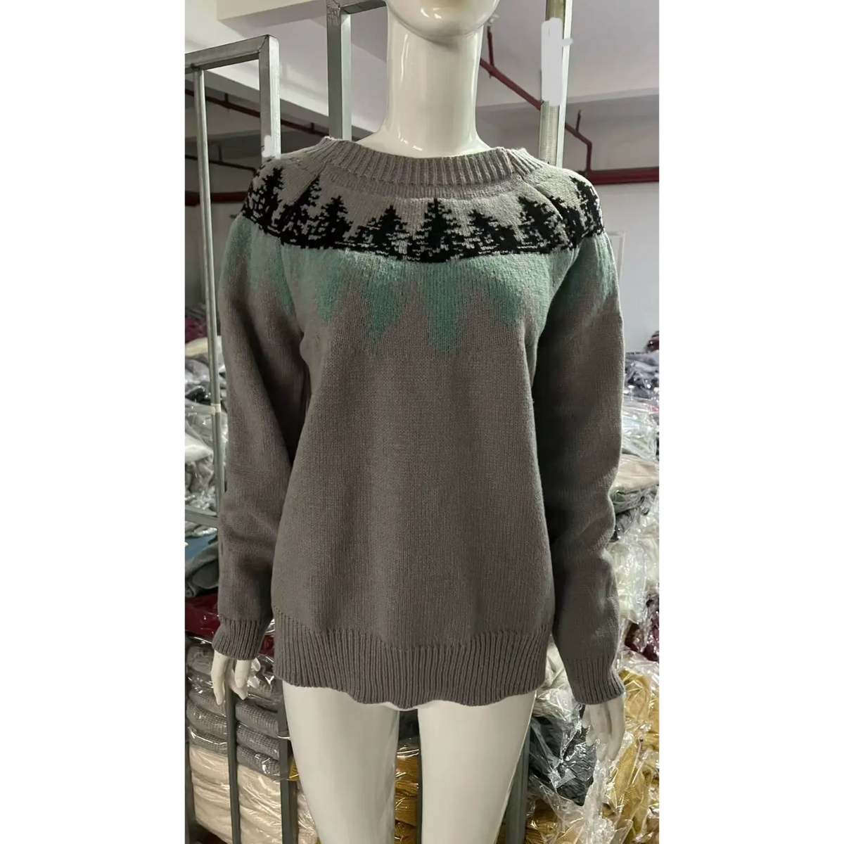 Front view of pine tree fair isle yoke knit sweater on mannequin