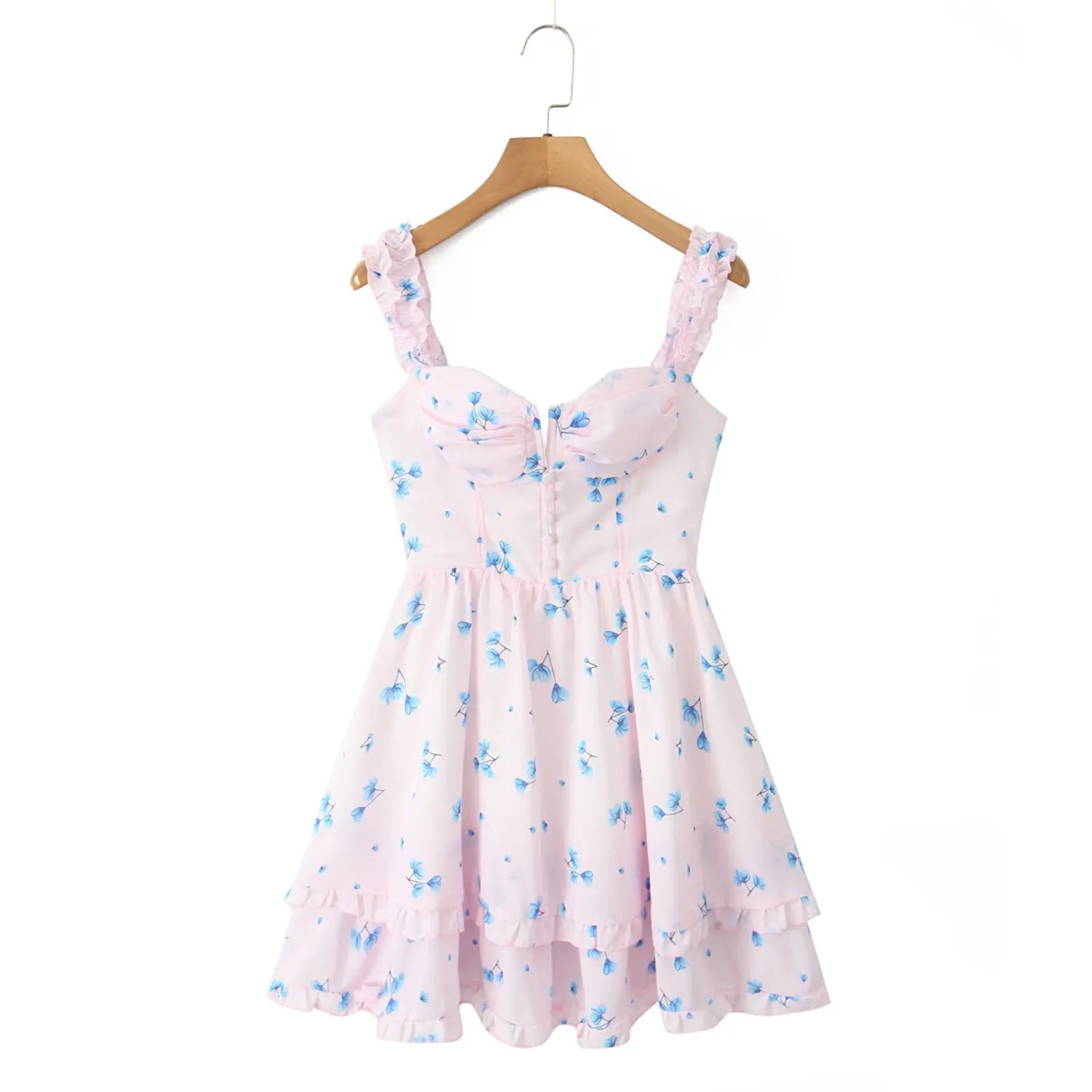 Hanging full view pink mini dress with blue floral print, ruffle elastic shoulder straps, bust ruched detail, front faux buttons, double ruffle tiered skirt