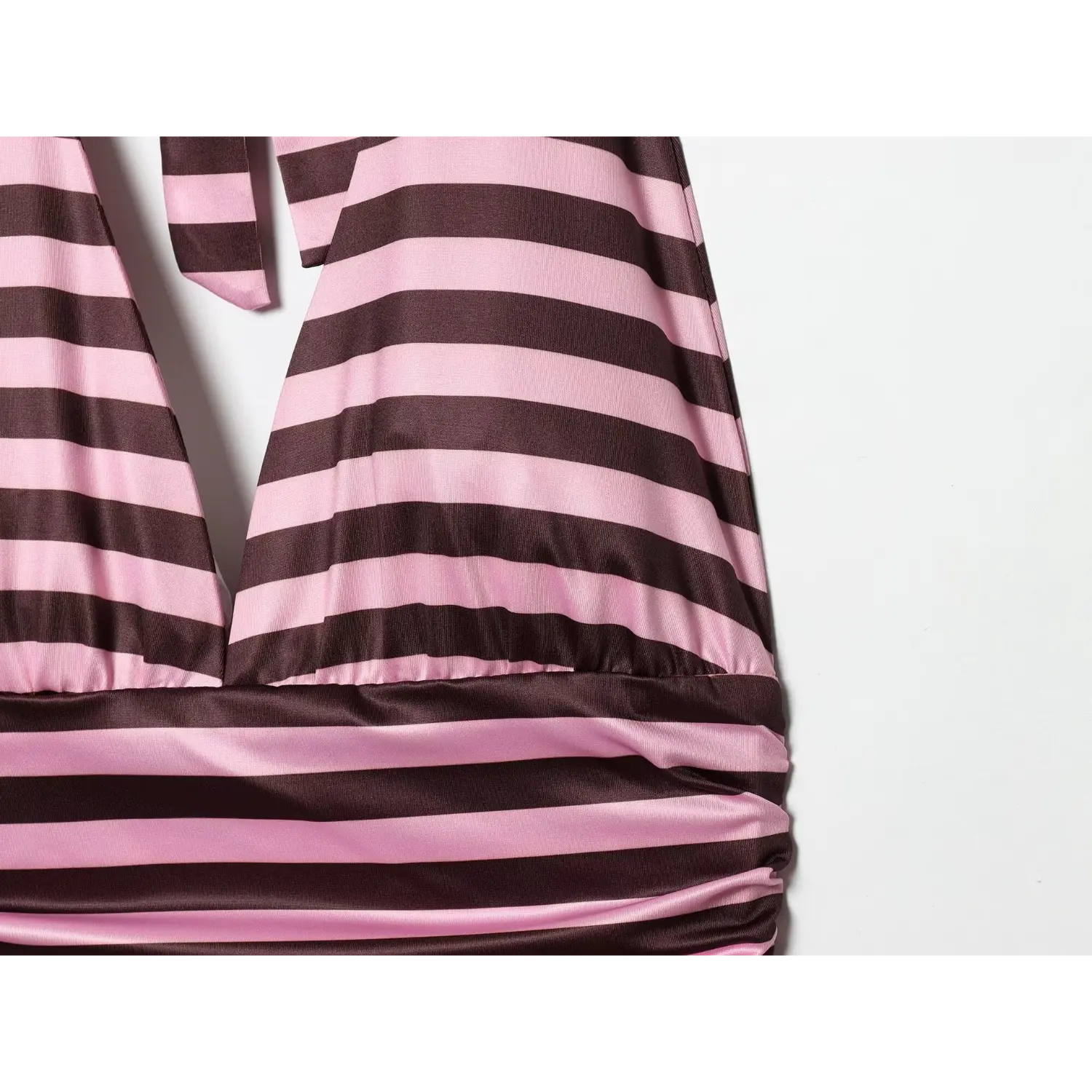 Macro shot of deep V bust gathered shirring, solid stripe waist band transition to side ruched torso, smooth satin stretch texture