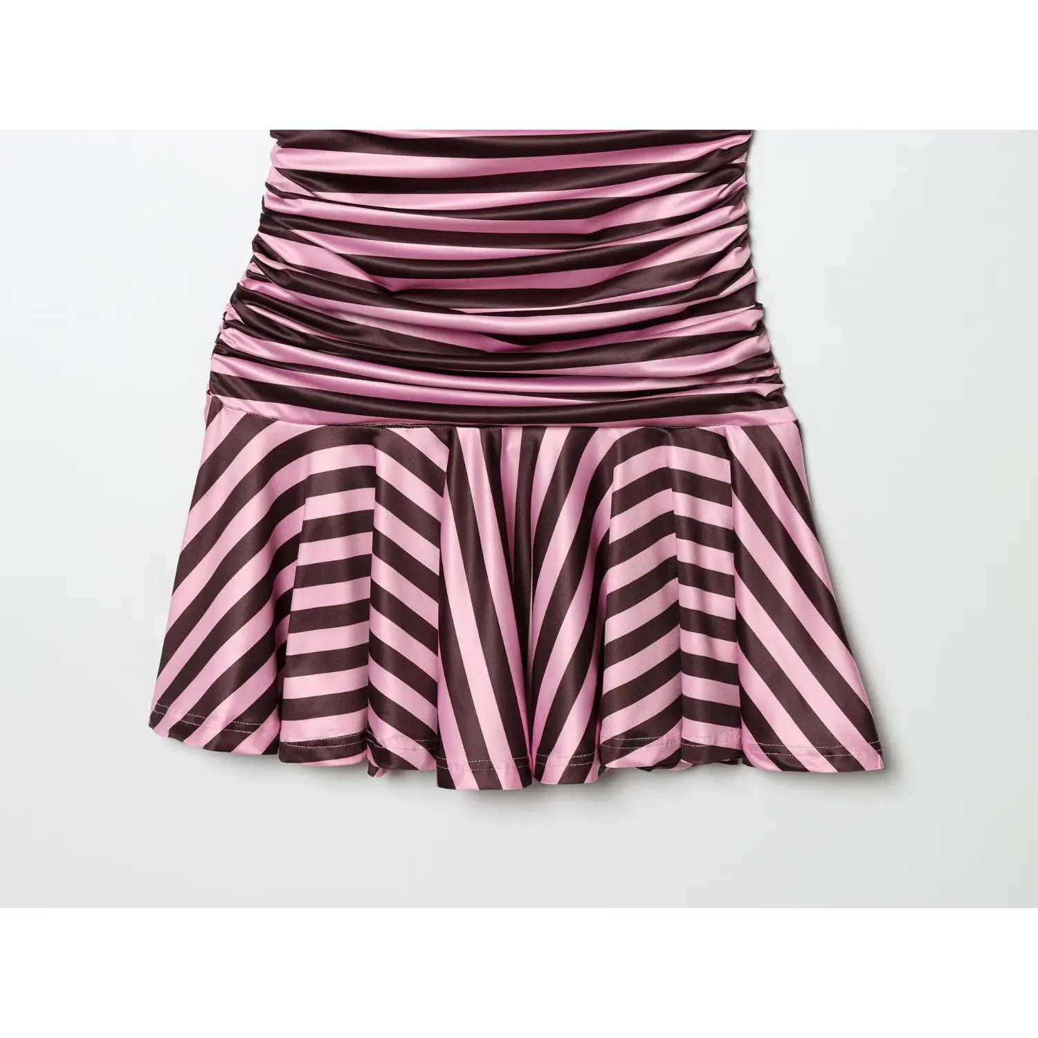 Lower skirt hem close-up, diagonal stripe flared ruffle hem, multi-panel godet fishtail design, neat lockstitch finished edge, stretch glossy fabric drape