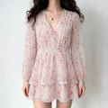 Front lifestyle shot on model, V-neck layered cherry blossom chiffon mini dress, long balloon sleeves, sweet romantic summer outfit