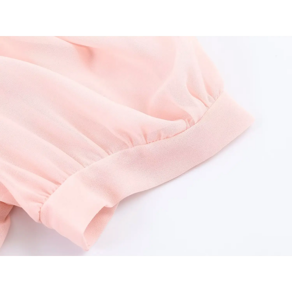 Close up of puff short sleeve cuff, gathered sleeve design of pink maxi dress