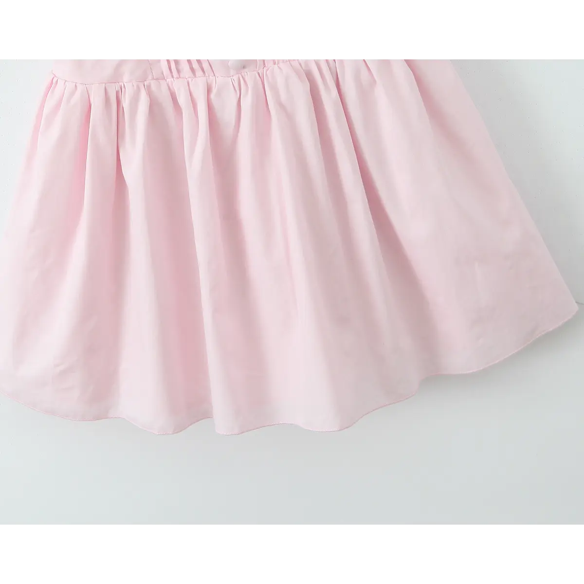 Close-up of A-line skirt showing fabric drape and clean, finished edge.