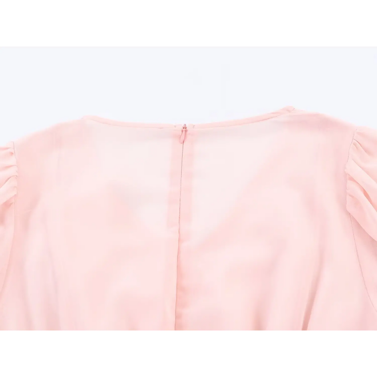 Close up of hidden back zipper and back neck stitching on pink chiffon maxi dress