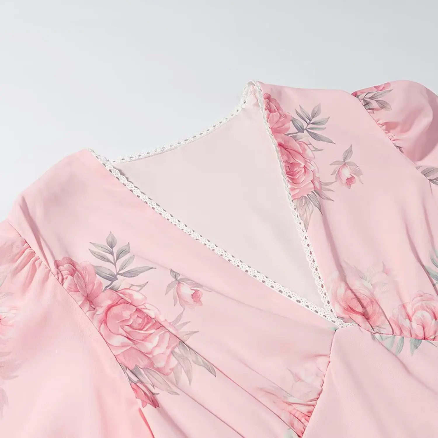 Front V neck partial close-up, delicate white scalloped lace trim piping, bust vertical ruched gather detail