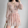 Women wearing blush pink floral chiffon mini dress, long puff sleeves, ruched bodice, flowy layered skirt, romantic casual outfit