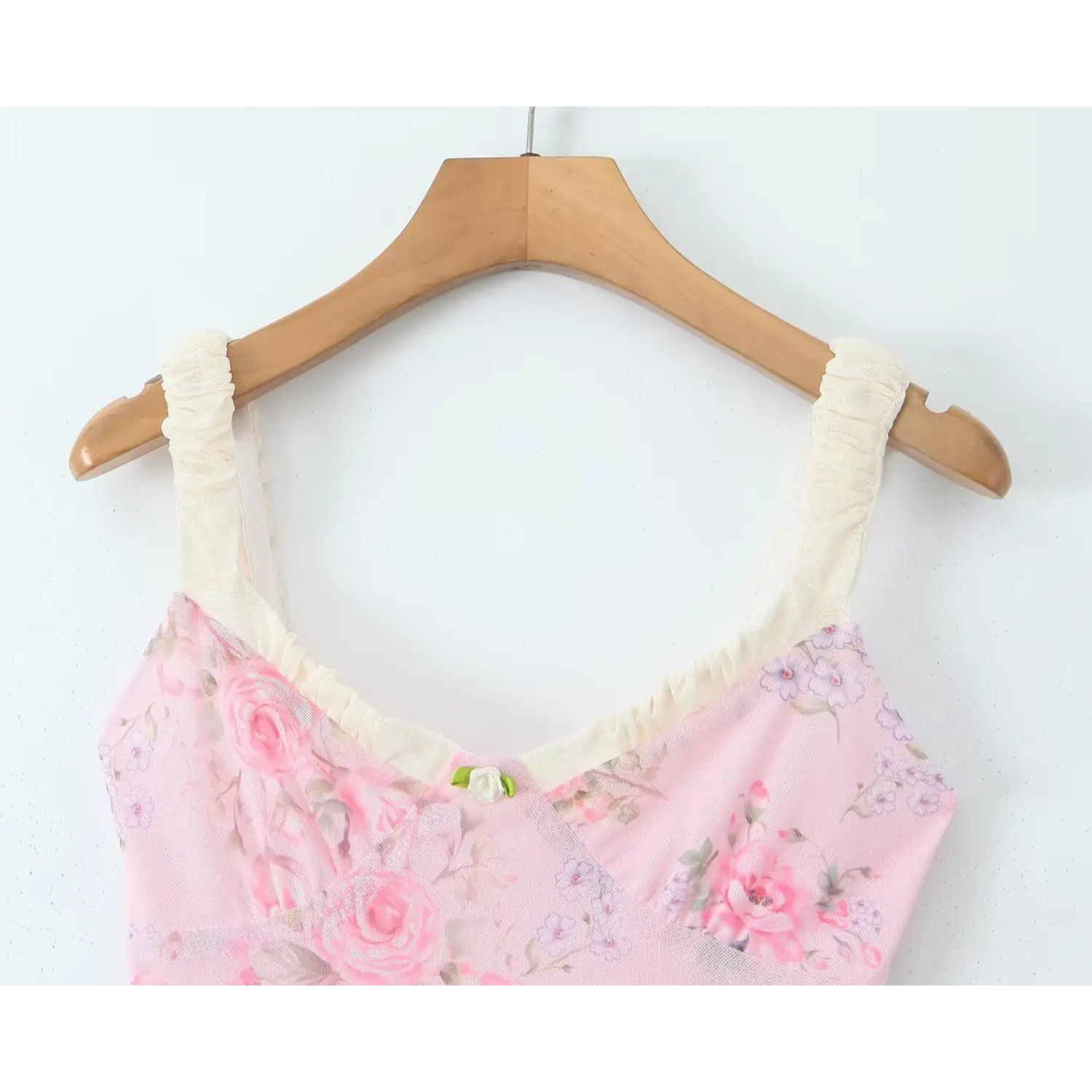 Close‑up v‑neckline, cream ruched mesh cami straps, tiny rose flower applique at bust, pink rose floral mesh dress