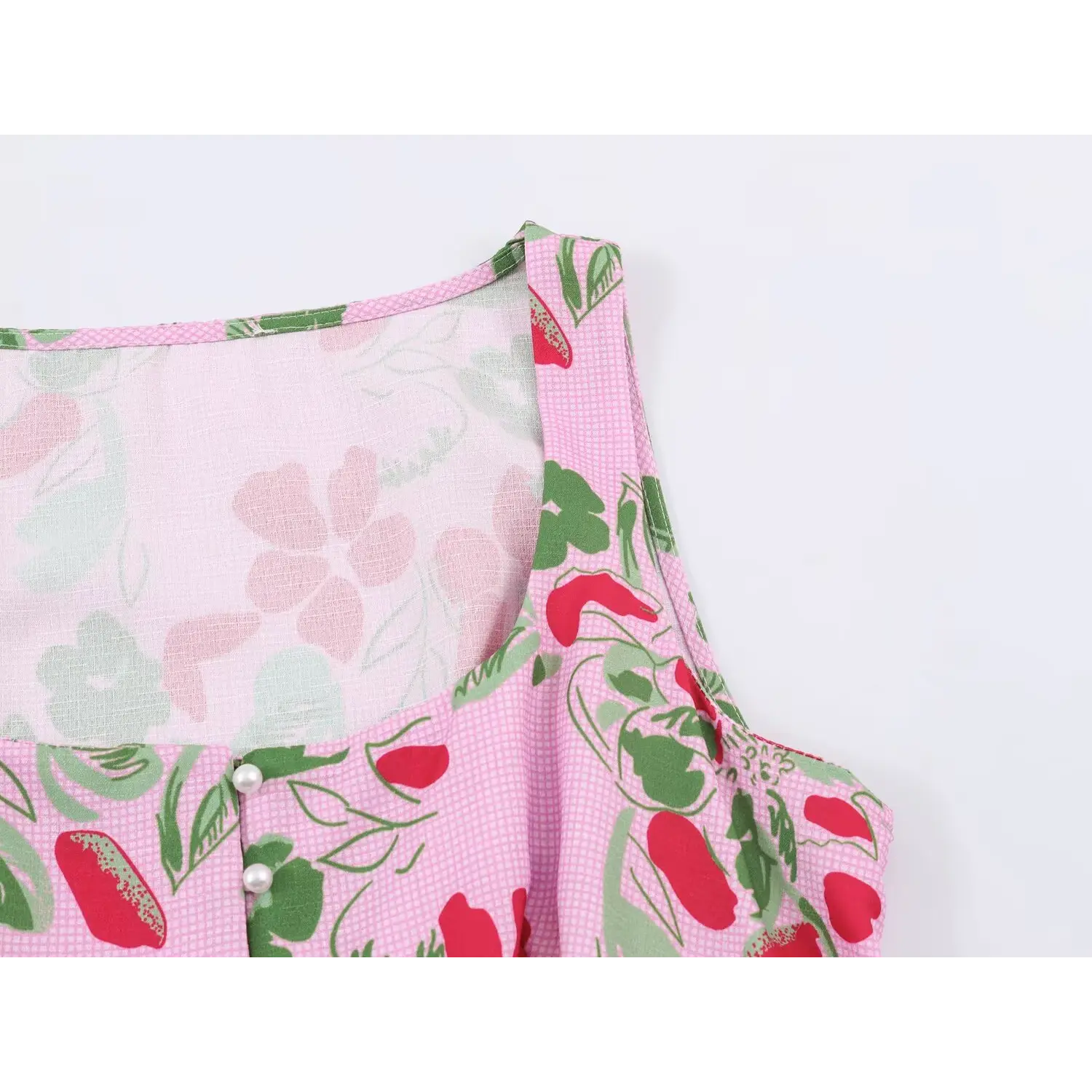 Shoulder strap and lining detail of pink floral fruit print sleeveless crop top