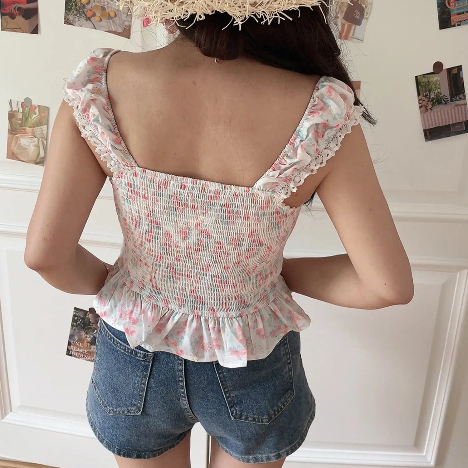 Women pink floral lace crop top back view, lace cap sleeve straps, full smocked elastic waist and ruffle hem