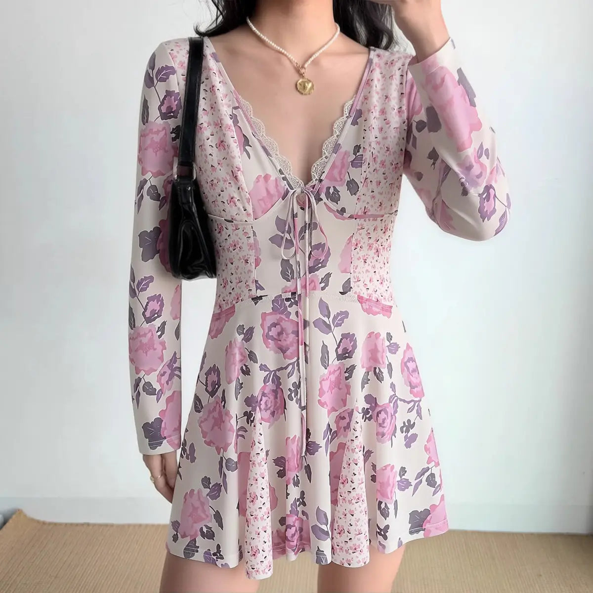 The dress styled on a model, highlighting the floral print, fitted bodice, and how it pairs with accessories.