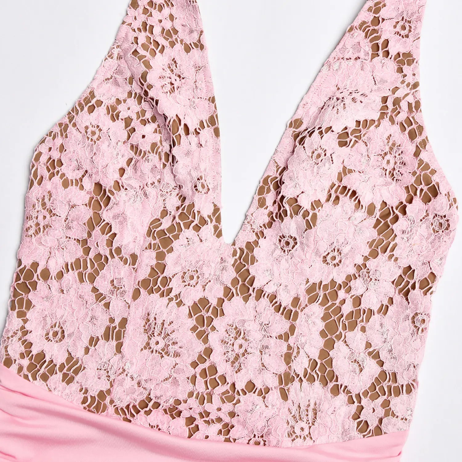 Close‑up flat shot pink floral hollow lace fabric of halter deep v‑neck bodice