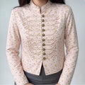 Model wearing pink ditsy floral satin stand collar military style cropped jacket front view