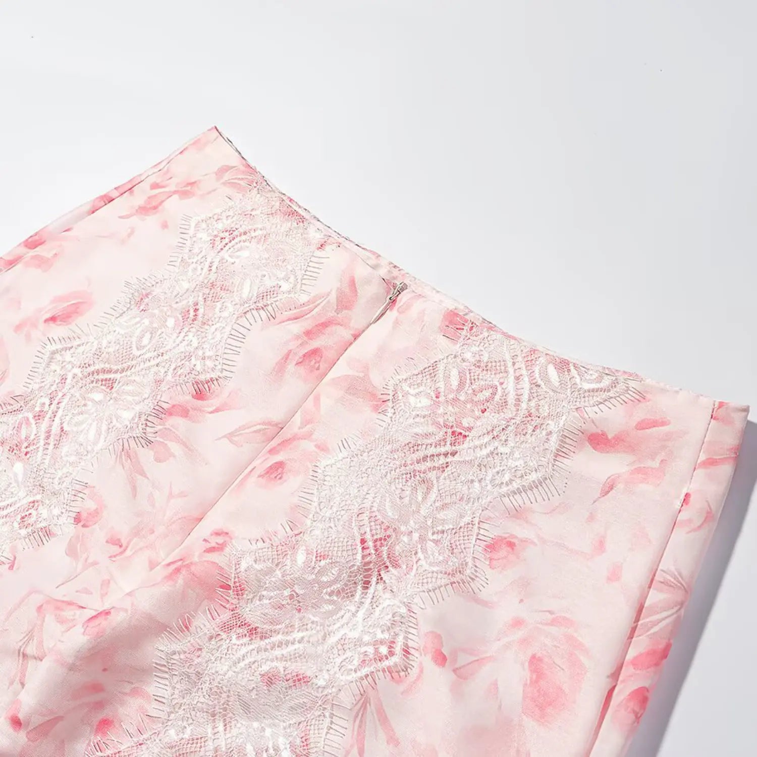 Detail shot rear invisible zipper and side lace panels floral mini skirt