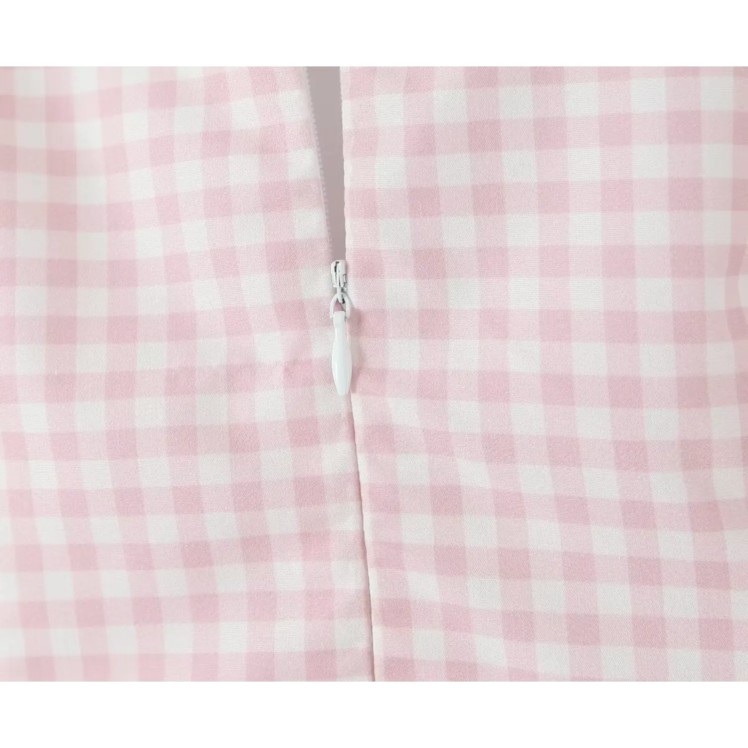 Extreme close‑up back concealed zipper pull pink white gingham woven fabric